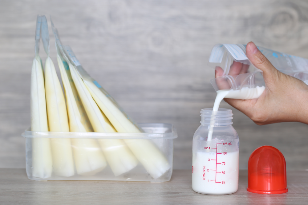 Storing breast milk and pouring into a bottle