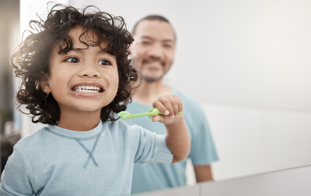 Young boy brushing his teeth