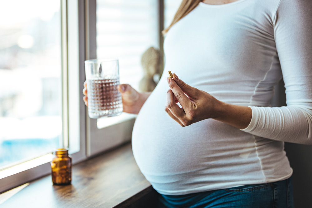 Pregnant woman taking medication