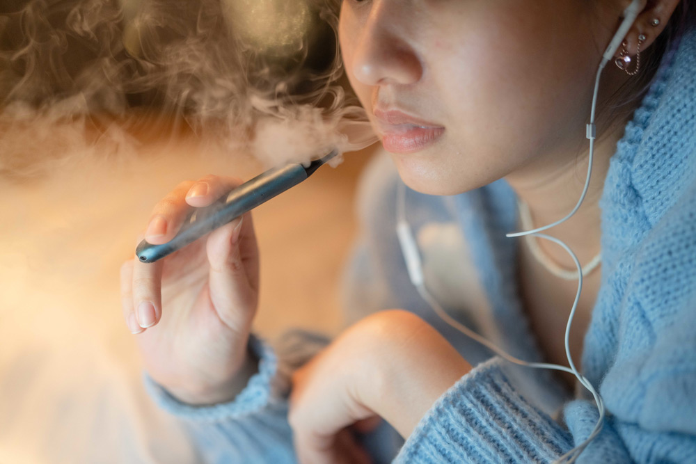 Teen girl vaping